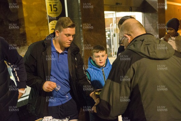 071215 - Cardiff Blues players feed the homeless on Charles Street, Cardiff -