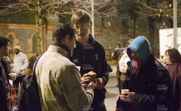 071215 - Cardiff Blues players feed the homeless on Charles Street, Cardiff -