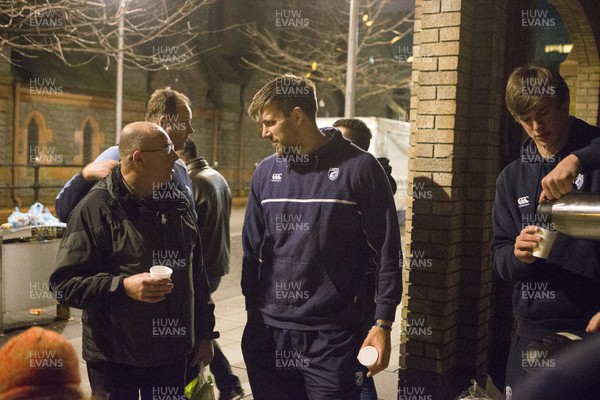 071215 - Cardiff Blues players feed the homeless on Charles Street, Cardiff -