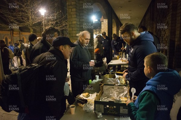 071215 - Cardiff Blues players feed the homeless on Charles Street, Cardiff -