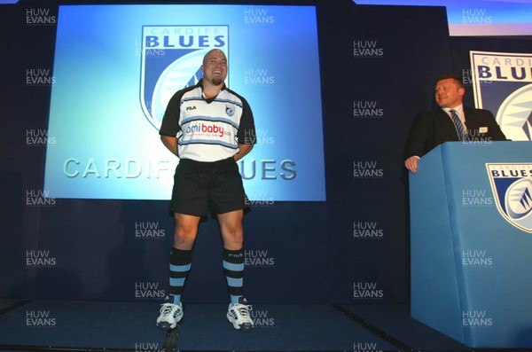 060603 - Cardiff Blues launch -  Dan Baugh models the new Cardiff Blues team strip at the launch at the Hilton Hotel, Cardiff, the first of the new provincial rugby teams in Wales to officially launch their team, watched by head coach Dai Young