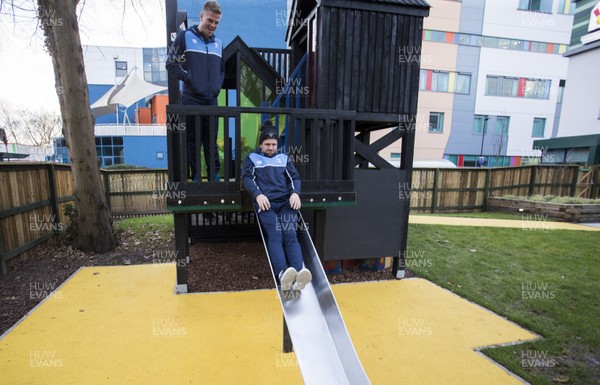 071217 - Cardiff Blues visit Ronald McDonald House at Noah's Ark Childrens Hospital at The Heath - Lewis Jones tries out the slide
