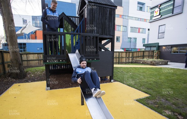 071217 - Cardiff Blues visit Ronald McDonald House at Noah's Ark Childrens Hospital at The Heath - Lewis Jones tries out the slide