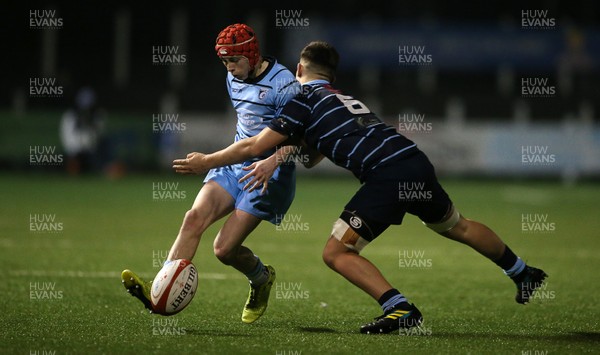 260219 - Cardiff Blues North U16s v Cardiff Blues South U16s - Regional Age Grade Championship - Gruff Tough of Blues South is tackled by Kian Evans of Blues North