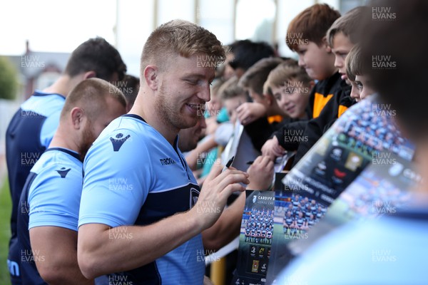 011018 - Cardiff Blues Open Training - Macauley Cook of Cardiff Blues signs autographs for local children