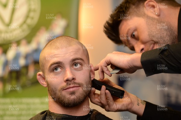 311213 - Cardiff Blues Charity Hair Shave -Leigh Halfpenny has his hair shaved off to raise money for Velindre in support of team Mattew Rees who is being treated for testicular cancer