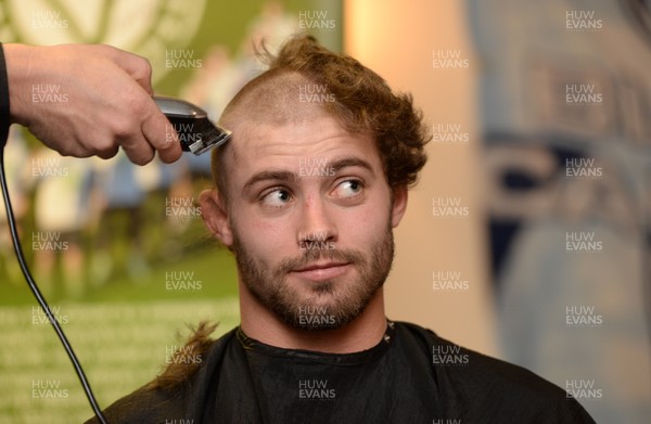 311213 - Cardiff Blues Charity Hair Shave -Leigh Halfpenny has his hair shaved off to raise money for Velindre in support of team Mattew Rees who is being treated for testicular cancer