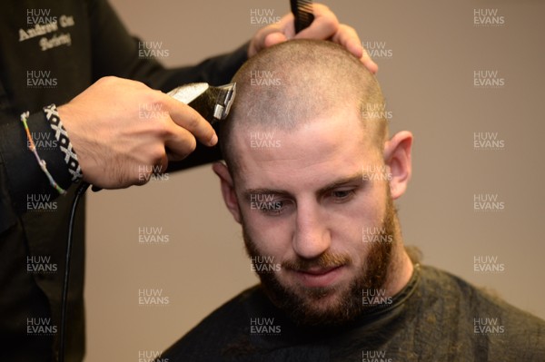 311213 - Cardiff Blues Charity Hair Shave -Alex Cuthbert has his hair shaved off to raise money for Velindre in support of team Mattew Rees who is being treated for testicular cancer