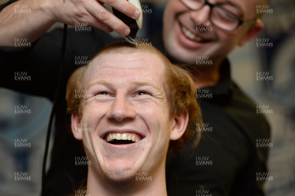 311213 - Cardiff Blues Charity Hair Shave -Rhys Patchell has his hair shaved off to raise money for Velindre in support of team Mattew Rees who is being treated for testicular cancer