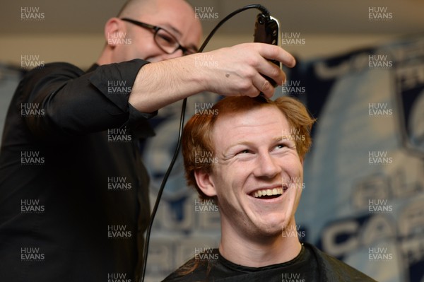 311213 - Cardiff Blues Charity Hair Shave -Rhys Patchell has his hair shaved off to raise money for Velindre in support of team Mattew Rees who is being treated for testicular cancer