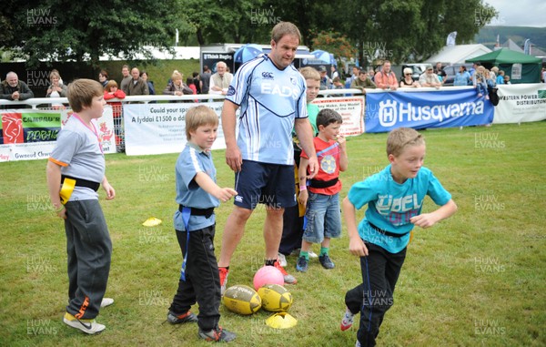 19.07.11 - Cardiff Blues at the Royal Welsh Show - Xavier Rush plays tag rugby with kids. 