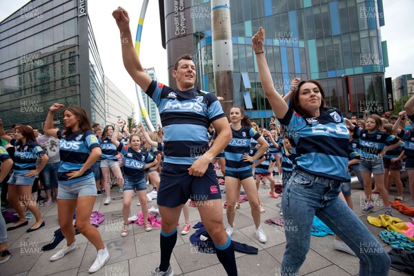 200713 - Cardiff Blues shirt launch - Cardiff Blues launch their new shirt for the 2013-14 season, with a flash mob dance routine featuring Blues player Robin Copeland outside Cardiff Library