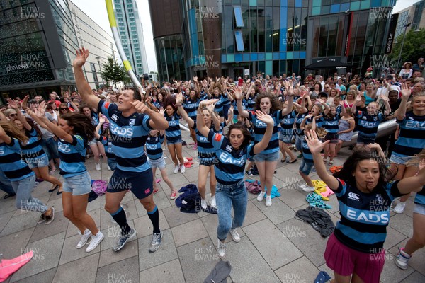 200713 - Cardiff Blues shirt launch - Cardiff Blues launch their new shirt for the 2013-14 season, with a flash mob dance routine featuring Blues player Robin Copeland outside Cardiff Library