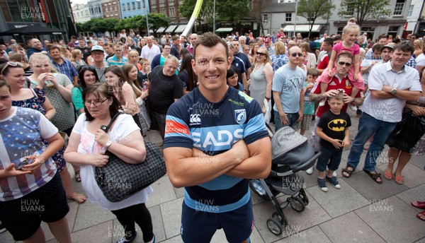 200713 - Cardiff Blues shirt launch - Cardiff Blues launch their new shirt for the 2013-14 season, with a flash mob dance routine featuring Blues player Robin Copeland outside Cardiff Library