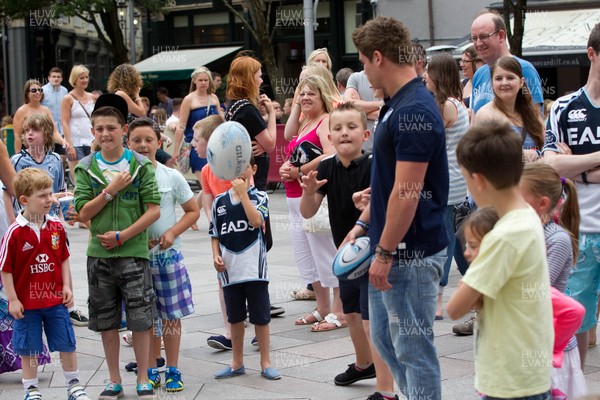 200713 - Cardiff Blues shirt launch - Cardiff Blues launch their new shirt for the 2013-14 season, with a flash mob dance routine outside Cardiff Library