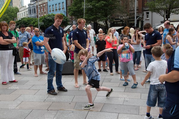 200713 - Cardiff Blues shirt launch - Cardiff Blues launch their new shirt for the 2013-14 season, with a flash mob dance routine outside Cardiff Library