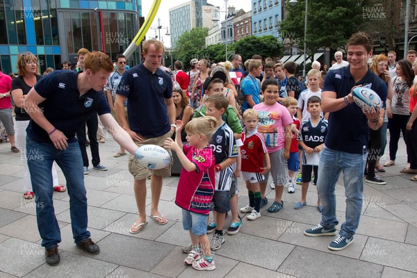 200713 - Cardiff Blues shirt launch - Cardiff Blues launch their new shirt for the 2013-14 season, with a flash mob dance routine outside Cardiff Library