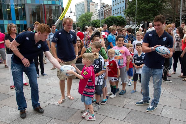 200713 - Cardiff Blues shirt launch - Cardiff Blues launch their new shirt for the 2013-14 season, with a flash mob dance routine outside Cardiff Library