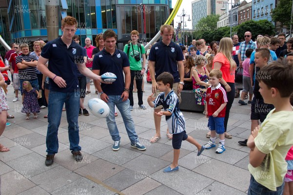 200713 - Cardiff Blues shirt launch - Cardiff Blues launch their new shirt for the 2013-14 season, with a flash mob dance routine outside Cardiff Library