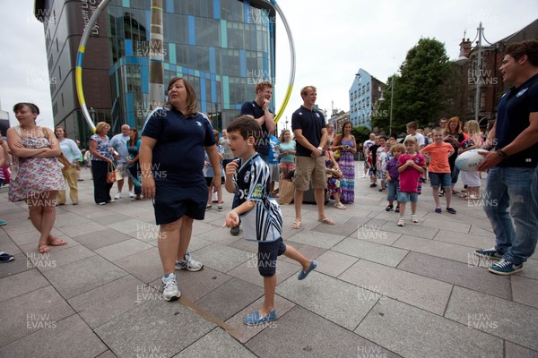 200713 - Cardiff Blues shirt launch - Cardiff Blues launch their new shirt for the 2013-14 season, with a flash mob dance routine outside Cardiff Library