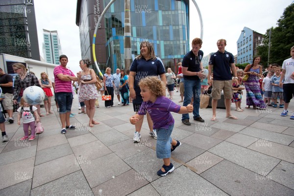 200713 - Cardiff Blues shirt launch - Cardiff Blues launch their new shirt for the 2013-14 season, with a flash mob dance routine outside Cardiff Library