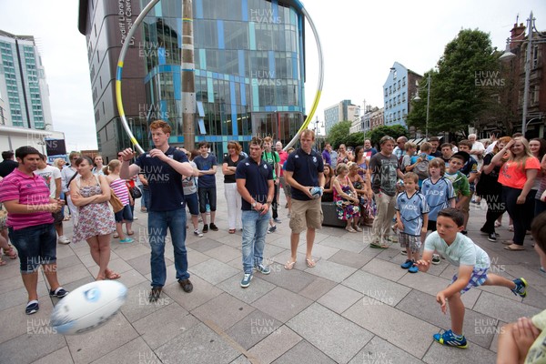 200713 - Cardiff Blues shirt launch - Cardiff Blues launch their new shirt for the 2013-14 season, with a flash mob dance routine outside Cardiff Library