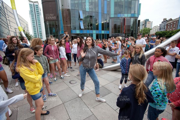 200713 - Cardiff Blues shirt launch - Cardiff Blues launch their new shirt for the 2013-14 season, with a flash mob dance routine outside Cardiff Library