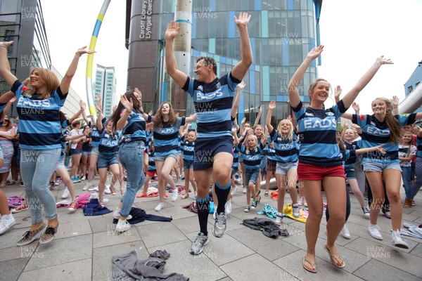 200713 - Cardiff Blues shirt launch - Cardiff Blues launch their new shirt for the 2013-14 season, with a flash mob dance routine outside Cardiff Library