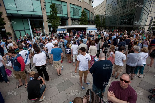 200713 - Cardiff Blues shirt launch - Cardiff Blues launch their new shirt for the 2013-14 season, with a flash mob dance routine outside Cardiff Library