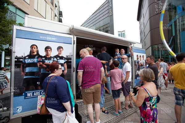 200713 - Cardiff Blues shirt launch - Cardiff Blues launch their new shirt for the 2013-14 season, with a flash mob dance routine outside Cardiff Library