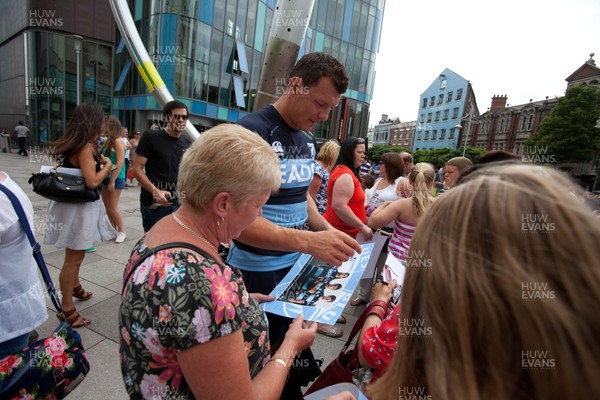 200713 - Cardiff Blues shirt launch - Cardiff Blues launch their new shirt for the 2013-14 season, with a flash mob dance routine outside Cardiff Library