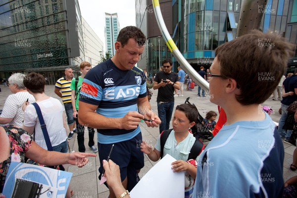 200713 - Cardiff Blues shirt launch - Cardiff Blues launch their new shirt for the 2013-14 season, with a flash mob dance routine outside Cardiff Library