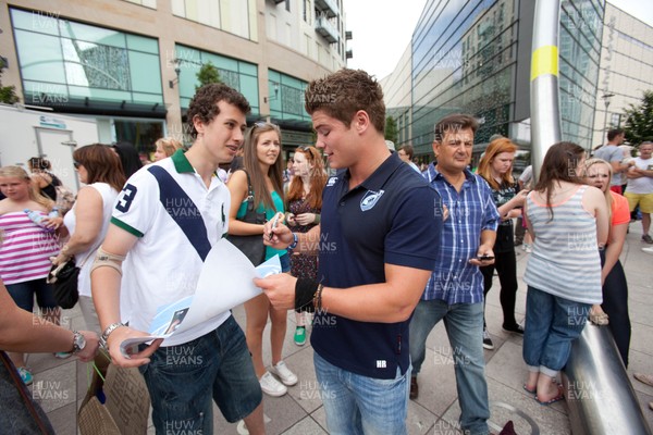 200713 - Cardiff Blues shirt launch - Cardiff Blues launch their new shirt for the 2013-14 season, with a flash mob dance routine outside Cardiff Library