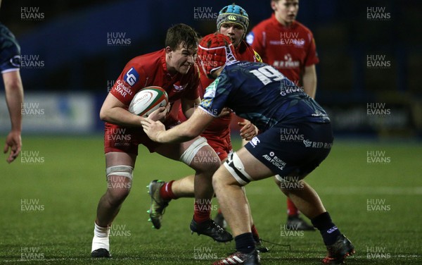 230118 - Cardiff Blues U18s v Scarlets U18s - Gethin Davies of Scarlets is tackled by Lewis Jameson of Cardiff