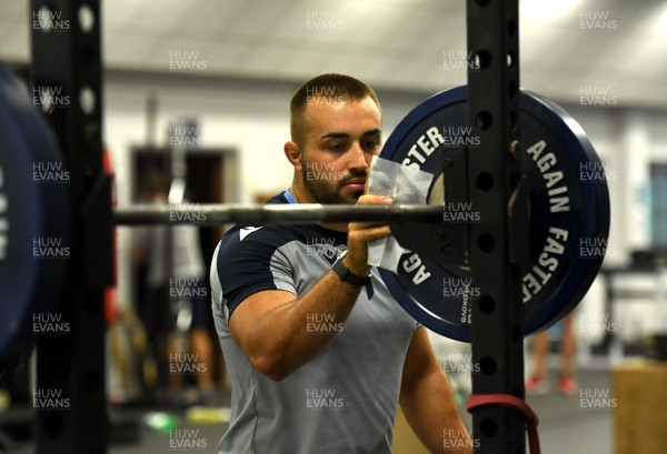 100720 - Cardiff Blues Training - Liam Belcher cleans equipment during training