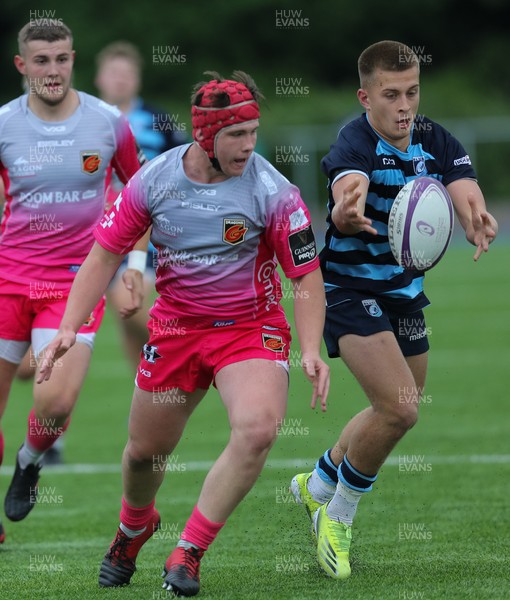 280621 - Cardiff Blues U18 v Dragons U18 - Dylan K-Griffiths of Dragons and Cameron Winnett of Cardiff Blues compete for the ball
