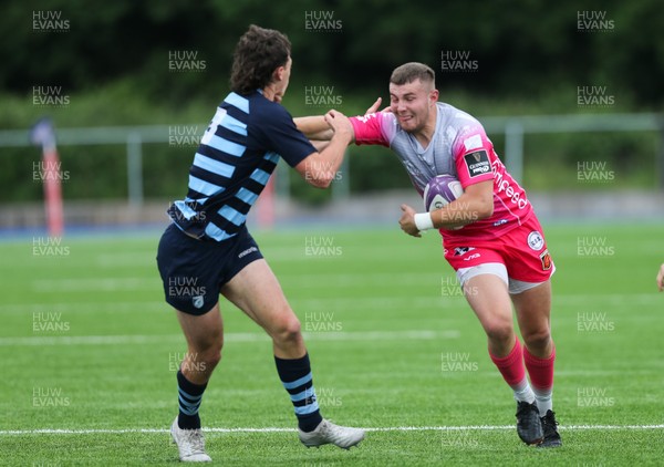 280621 - Cardiff Blues U18 v Dragons U18 - Ollie Andrews of Dragons takes on Louie Hennessey-Booth of Cardiff Blues