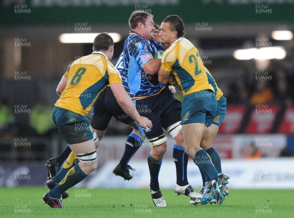 24.11.09 - Cardiff Blues v Australia - Cardiff Blues' Xavier Rush takes on Australia's Quade Cooper. 