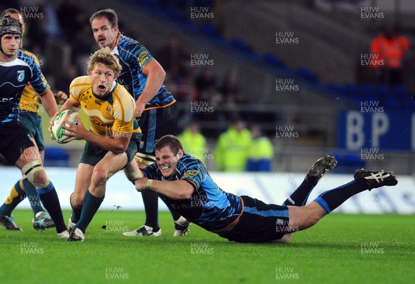 24.11.09 - Cardiff Blues v Australia Australia's Lachie Turner is tackled by Cardiff Blues' Sam Hobbs 