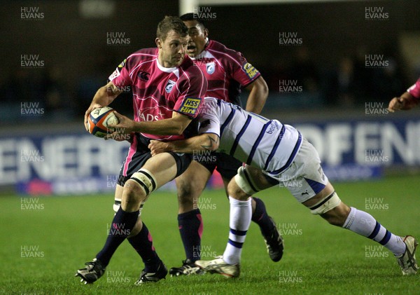 31.10.08 ... Cardiff Blues v Bath, EDF Energy Cup. -  Blues Deiniol Jones is held by Baths James Scaysbrook 