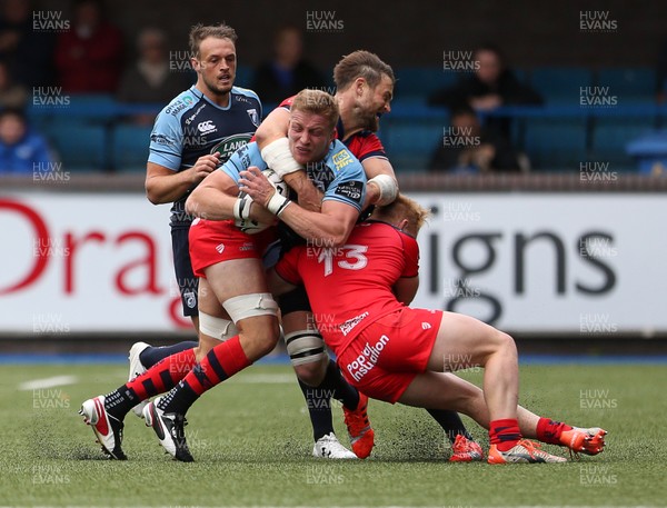 200816 - Cardiff Blues v Bristol Rugby - Pre Season Friendly - Macauley Cook of Cardiff Blues is tackled by Jon Fisher and Will Hurrel of Bristol Rugby