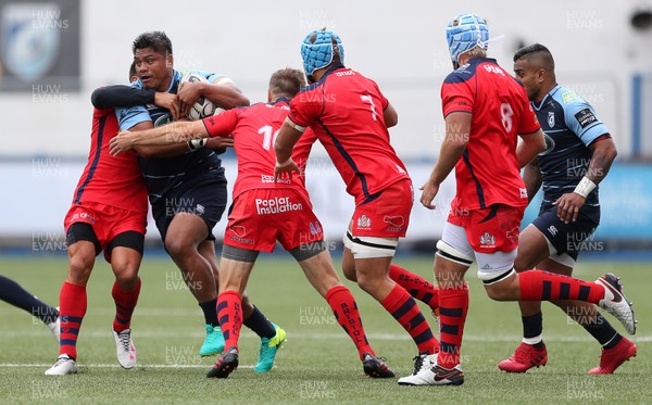 200816 - Cardiff Blues v Bristol Rugby - Pre Season Friendly - Nick Williams of Cardiff Blues is tackled by Gavin Henson and Adrian Jarvis of Bristol Rugby