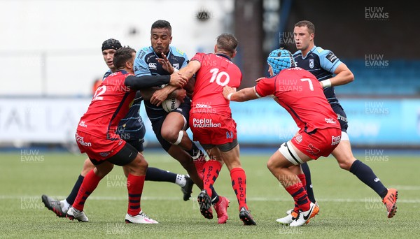 200816 - Cardiff Blues v Bristol Rugby - Pre Season Friendly - Rey Lee Lo of Cardiff Blues is tackled by Gavin Henson and Adrian Jarvis of Bristol Rugby