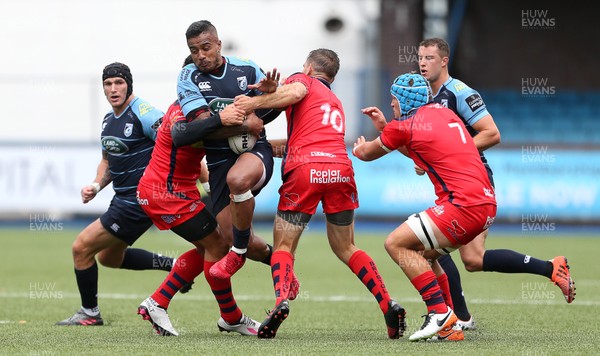 200816 - Cardiff Blues v Bristol Rugby - Pre Season Friendly - Rey Lee Lo of Cardiff Blues is tackled by Gavin Henson and Adrian Jarvis of Bristol Rugby