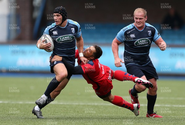 200816 - Cardiff Blues v Bristol Rugby - Pre Season Friendly - Tom James of Cardiff Blues is tackled by Gavin Henson of Bristol Rugby