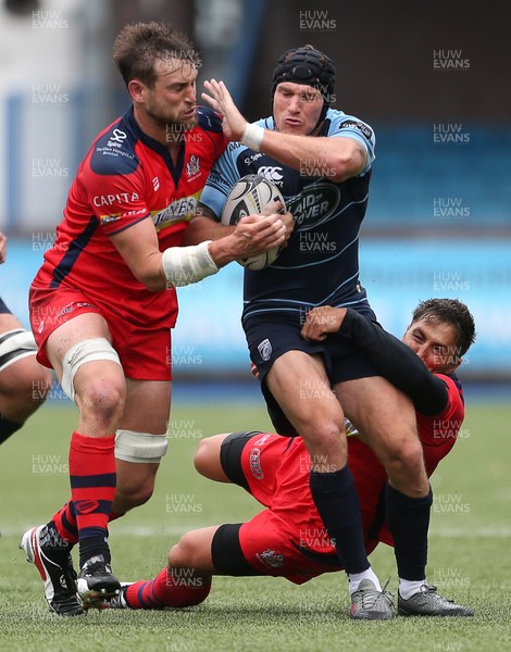 200816 - Cardiff Blues v Bristol Rugby - Pre Season Friendly - Tom James of Cardiff Blues is tackled by Gavin Henson and Jon Fisher of Bristol Rugby