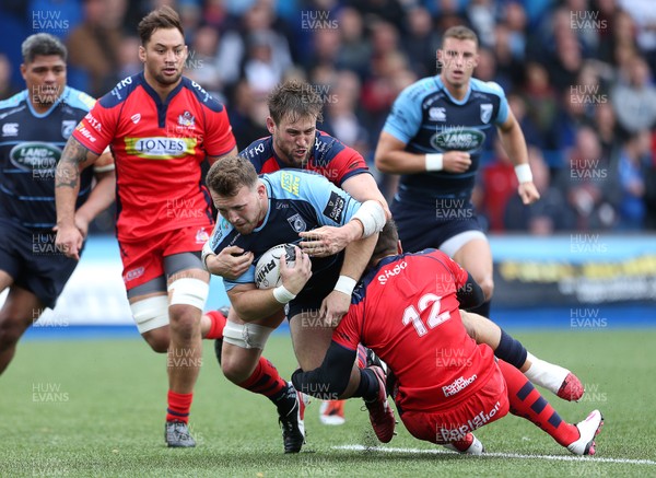 200816 - Cardiff Blues v Bristol Rugby - Pre Season Friendly - Dillon Lewis of Cardiff Blues is tackled by Jon Fisher and Gavin Henson of Bristol Rugby