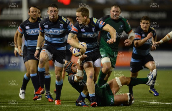 130913 - Cardiff Blues v Connacht - RaboDirect PRO12 -Owen Williams of Cardiff Blues is tackled by John Muldoon of Connacht