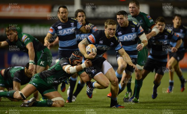 130913 - Cardiff Blues v Connacht - RaboDirect PRO12 -Owen Williams of Cardiff Blues is tackled by John Muldoon of Connacht