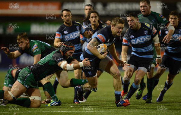 130913 - Cardiff Blues v Connacht - RaboDirect PRO12 -Owen Williams of Cardiff Blues is tackled by John Muldoon of Connacht